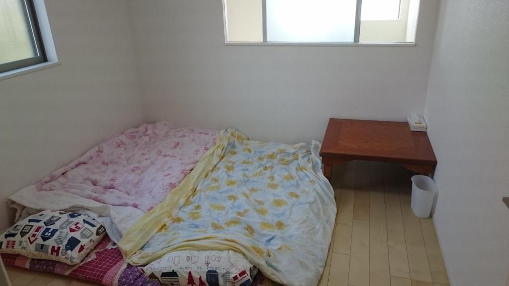 Postel nebo postele na pokoji v ubytování バイキング樫本