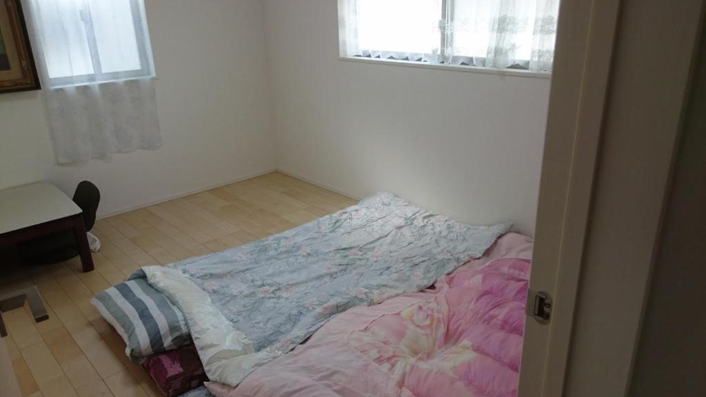 Postel nebo postele na pokoji v ubytování バイキング樫本
