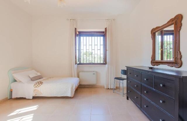Postel nebo postele na pokoji v ubytování Villa Degli Ulivi