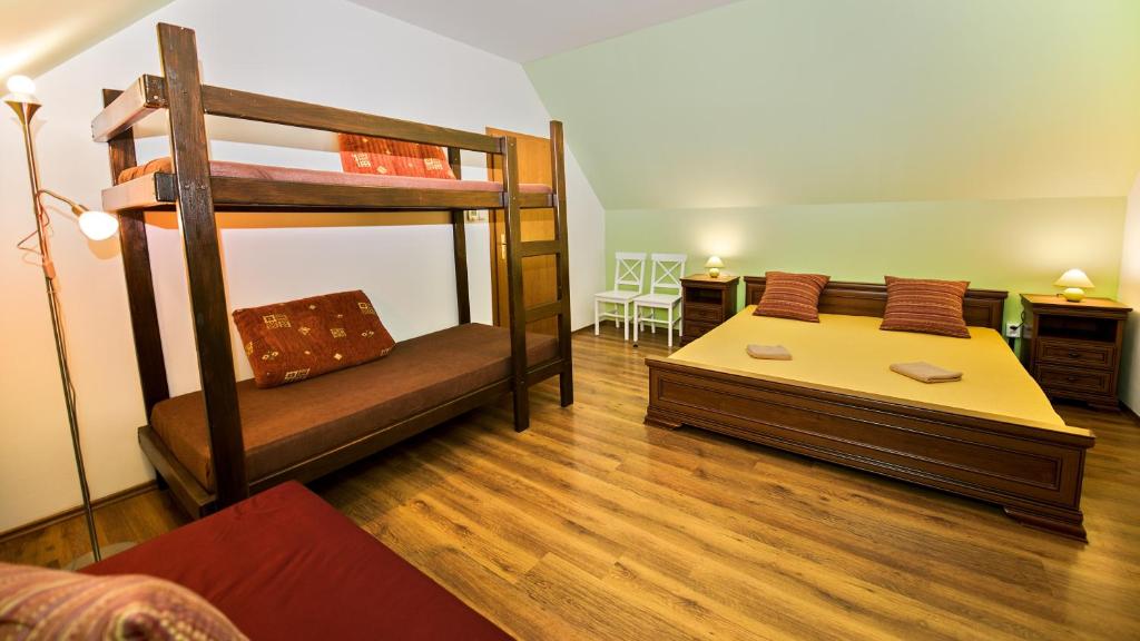 Postel nebo postele na pokoji v ubytování Apartmány Pod Čerťákem