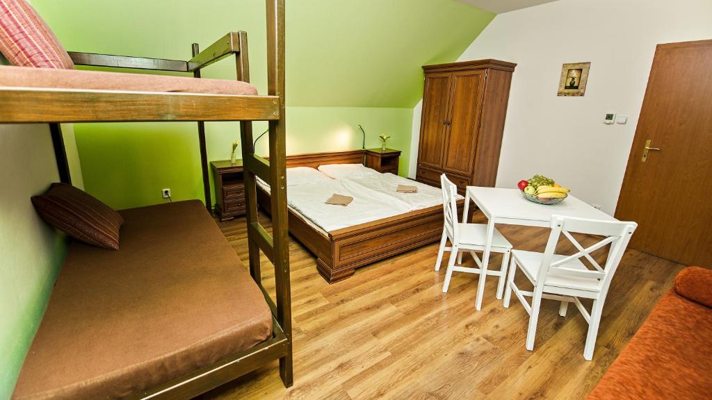 Postel nebo postele na pokoji v ubytování Apartmány Pod Čerťákem