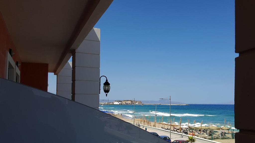 a view of the beach from a building at Blue Sky Hotel Apartments in Rethymno
