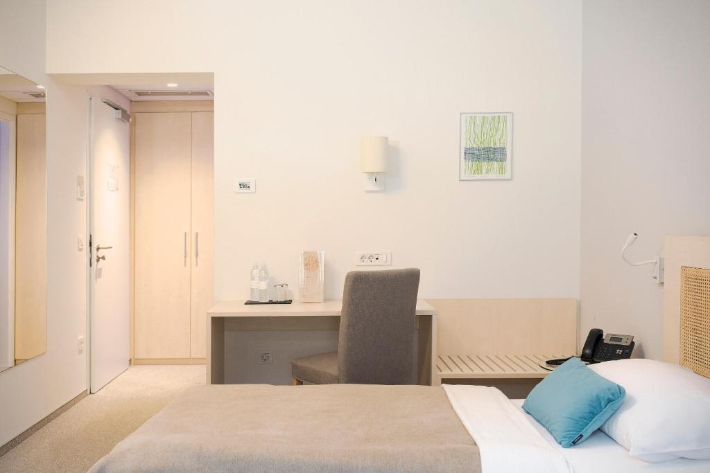 Postel nebo postele na pokoji v ubytování Art Hotel