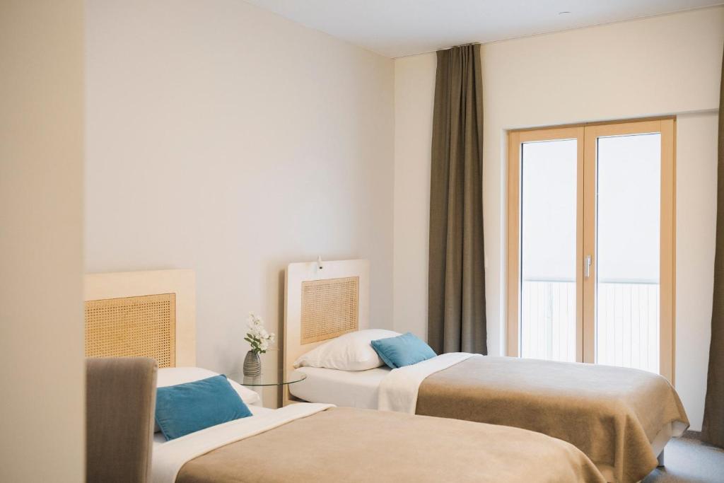 Postel nebo postele na pokoji v ubytování Art Hotel