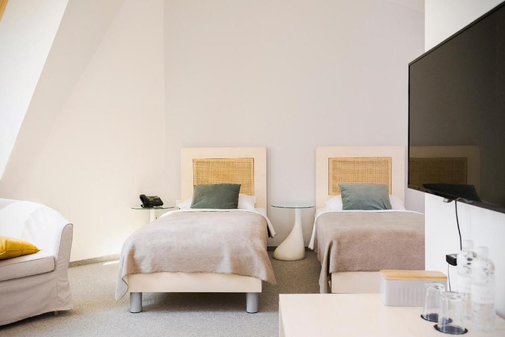Postel nebo postele na pokoji v ubytování Art Hotel