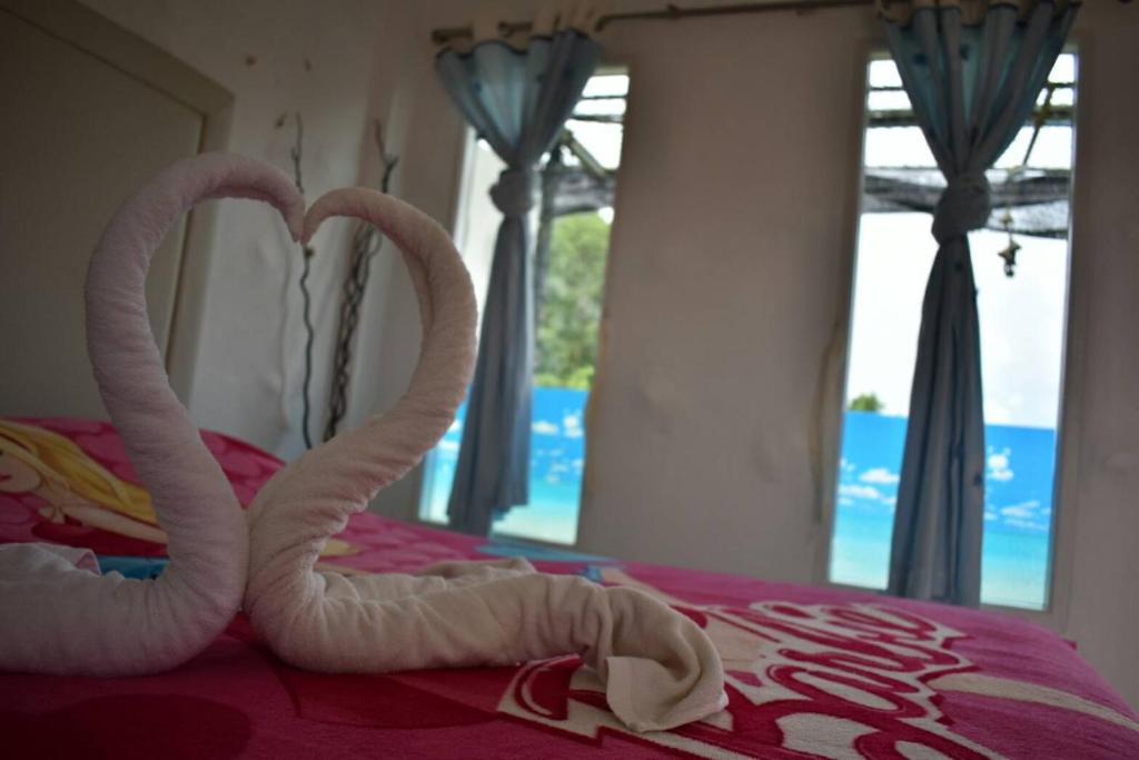 Postel nebo postele na pokoji v ubytování Rai Win Resort
