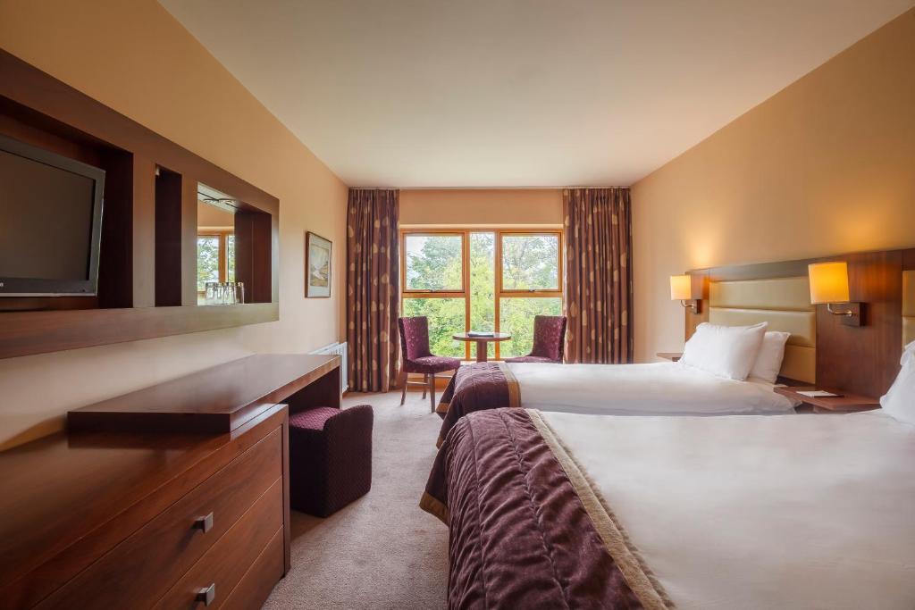 Postel nebo postele na pokoji v ubytování Westport Woods Hotel & Spa