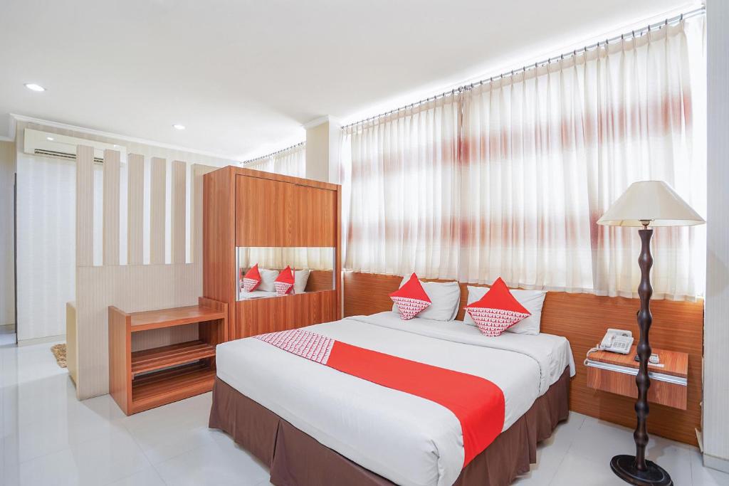 Ein Bett oder Betten in einem Zimmer der Unterkunft Maumu Hotel & Lounge