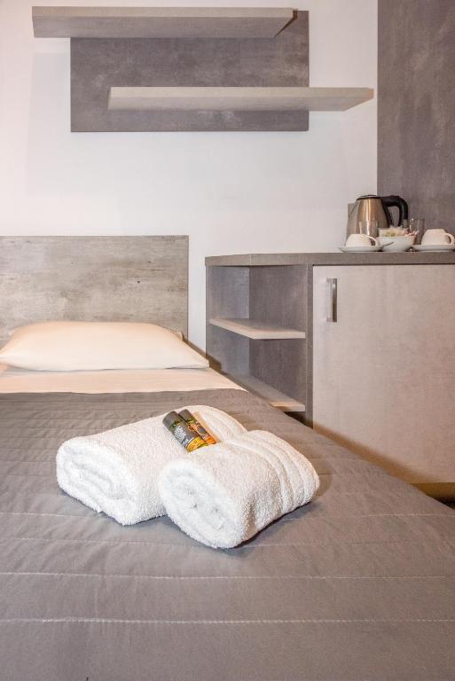a white towel sitting on top of a bed at Xasteria in Elafonisi