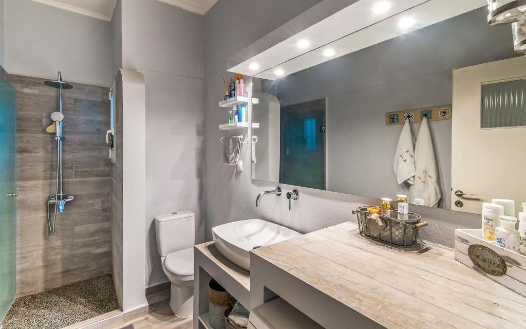 A bathroom at Villa Myrina with Sea View BY APOKORONAS-VILLAS