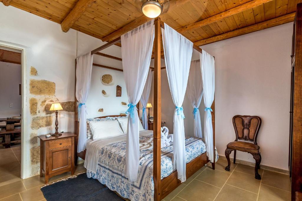 A bed or beds in a room at Villa Myrina with Sea View BY APOKORONAS-VILLAS