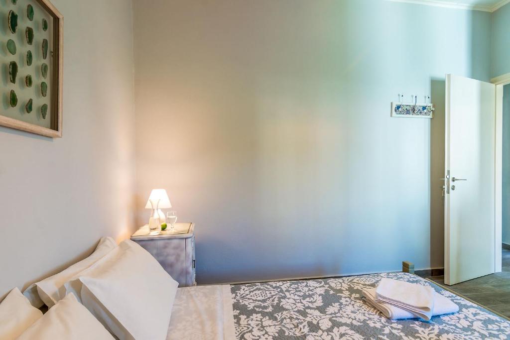 A bed or beds in a room at Villa Myrina with Sea View BY APOKORONAS-VILLAS