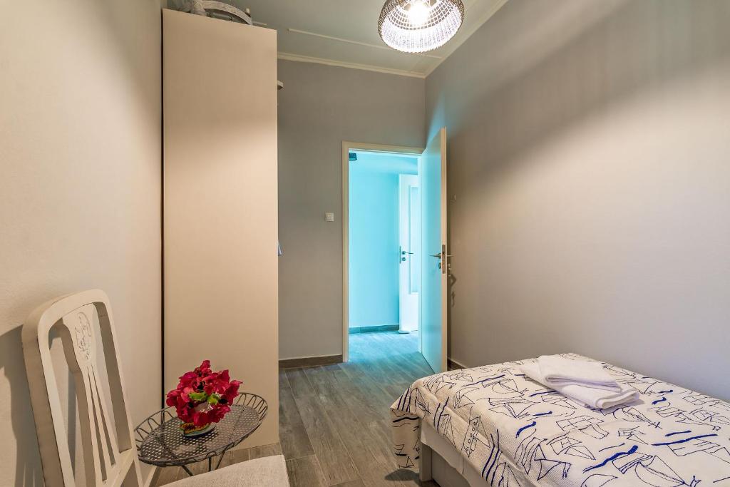 A bed or beds in a room at Villa Myrina with Sea View BY APOKORONAS-VILLAS