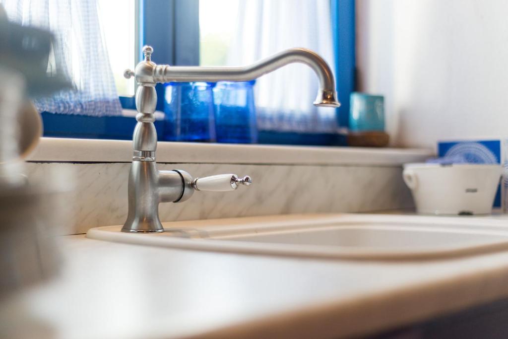 A bathroom at Villa Myrina with Sea View BY APOKORONAS-VILLAS