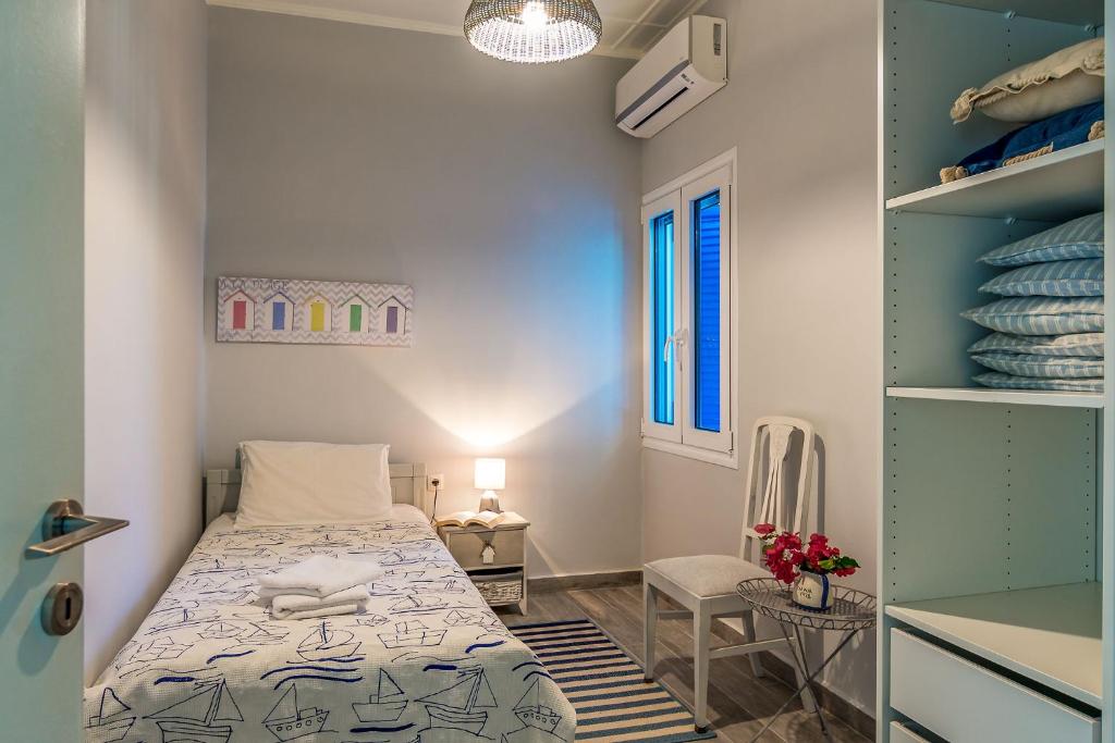 A bed or beds in a room at Villa Myrina with Sea View BY APOKORONAS-VILLAS