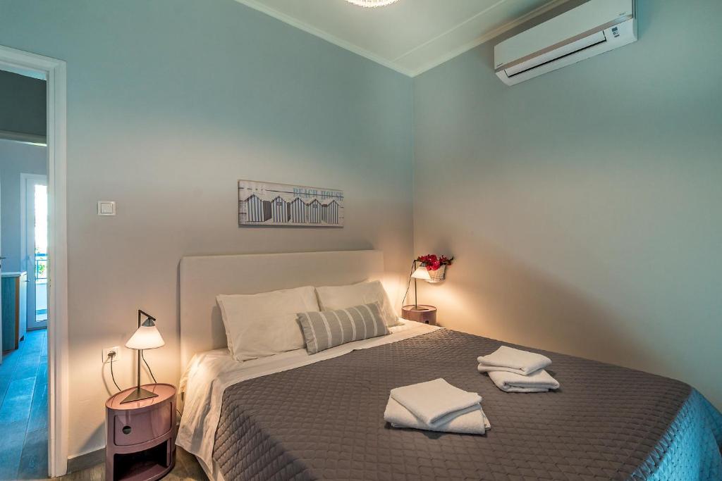 A bed or beds in a room at Villa Myrina with Sea View BY APOKORONAS-VILLAS