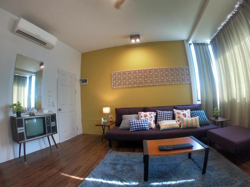 Posezení v ubytování Baan Nai Soi Mini Hotel