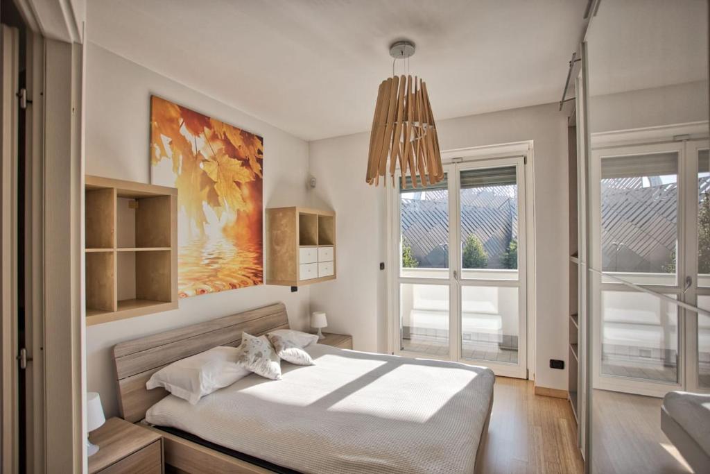 Tempat tidur dalam kamar di MYHOUSE INN Politecnico - Affitti Brevi Italia