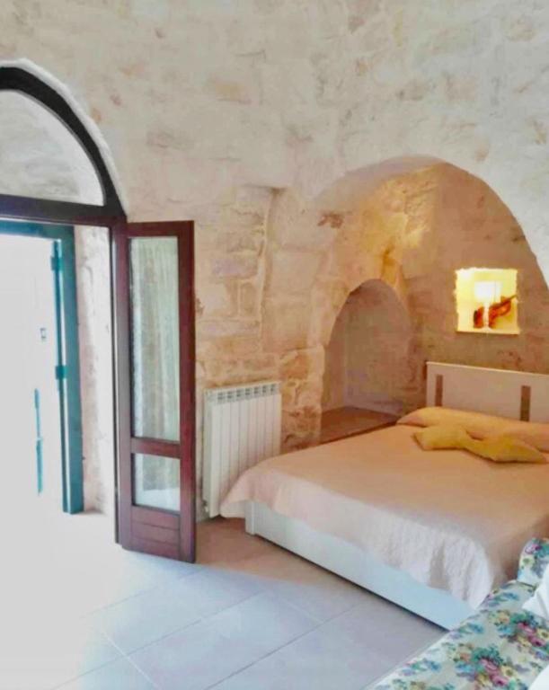 Postel nebo postele na pokoji v ubytování Villa Degli Ulivi