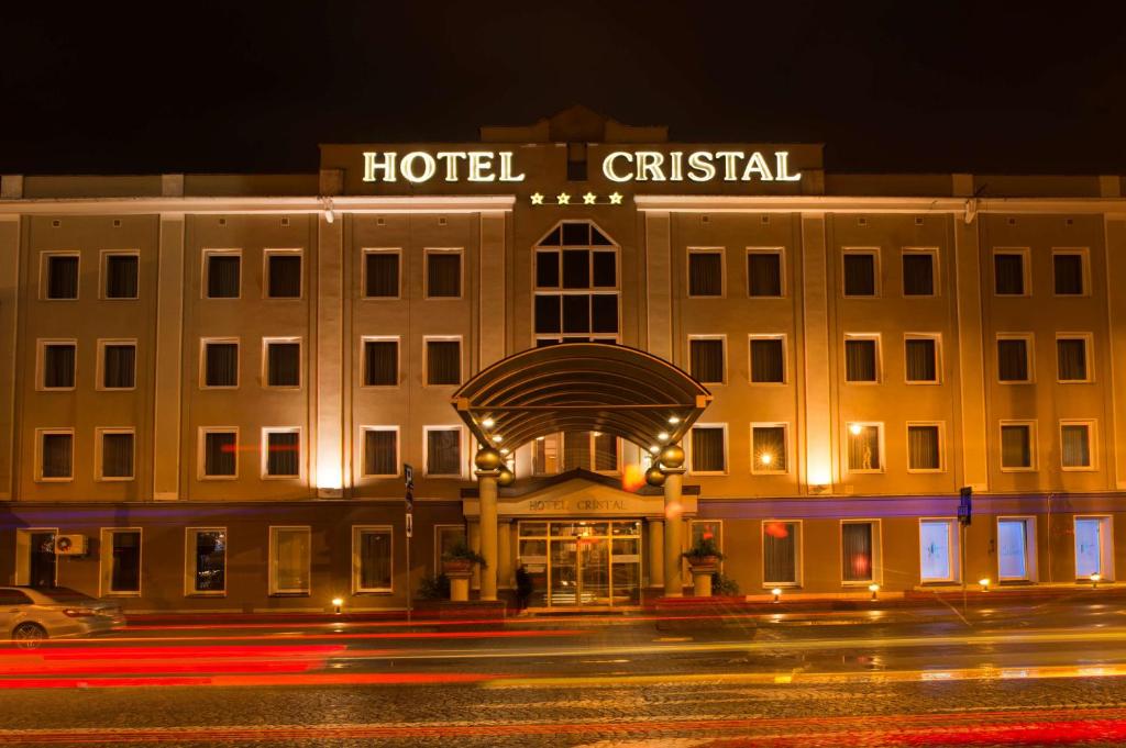 a large building with a clock on the front of it at Best Western Hotel Cristal in Białystok