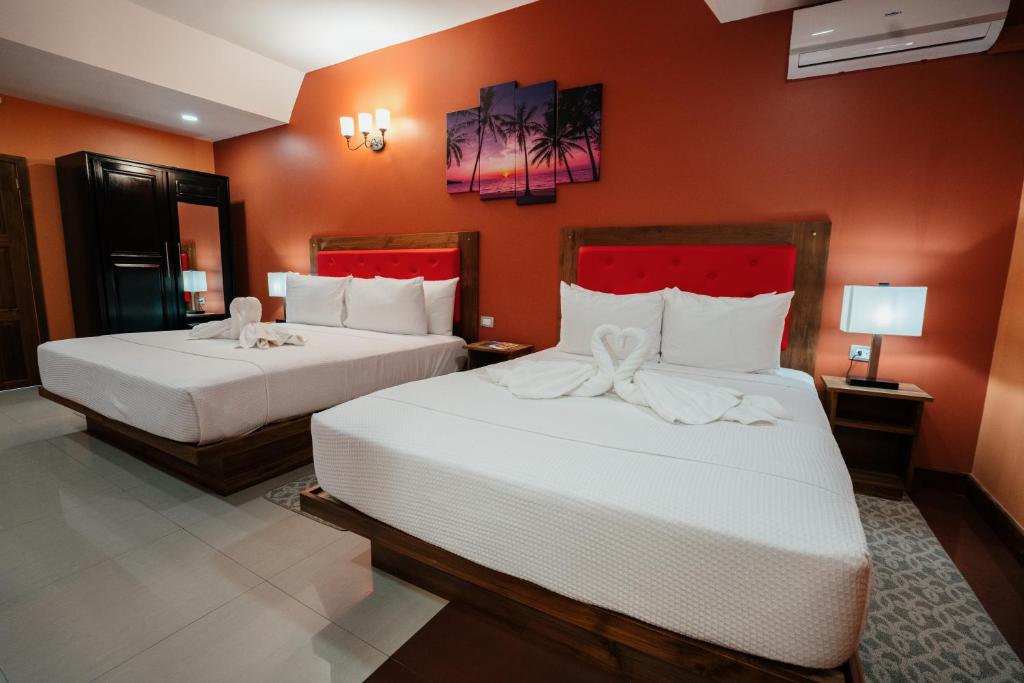 Posteľ alebo postele v izbe v ubytovaní Runway Hotel
