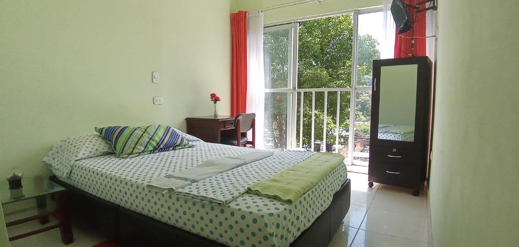 Postel nebo postele na pokoji v ubytování Hospedaje Alto de San Luis - Vivienda Turística RNT-90280