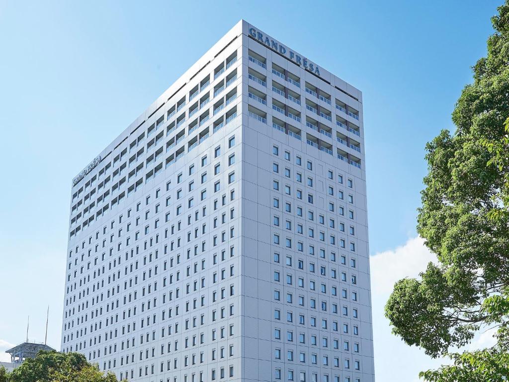 a tall building with a clock on top of it at Sotetsu Grand Fresa Tokyo-Bay Ariake in Tokyo
