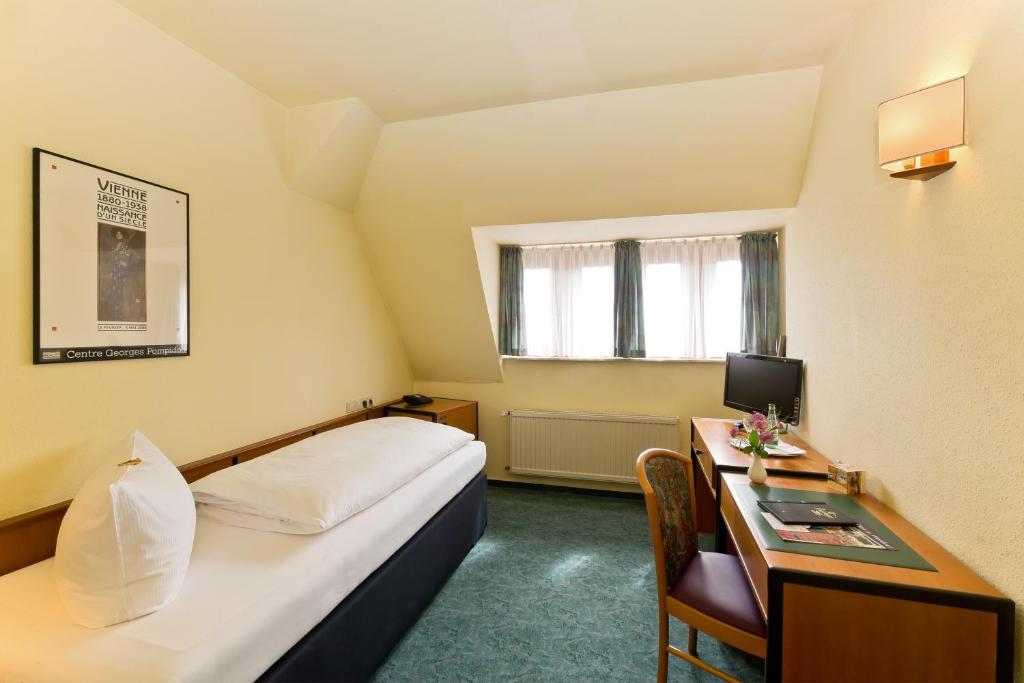 Postel nebo postele na pokoji v ubytování Hotel Katharinenhof