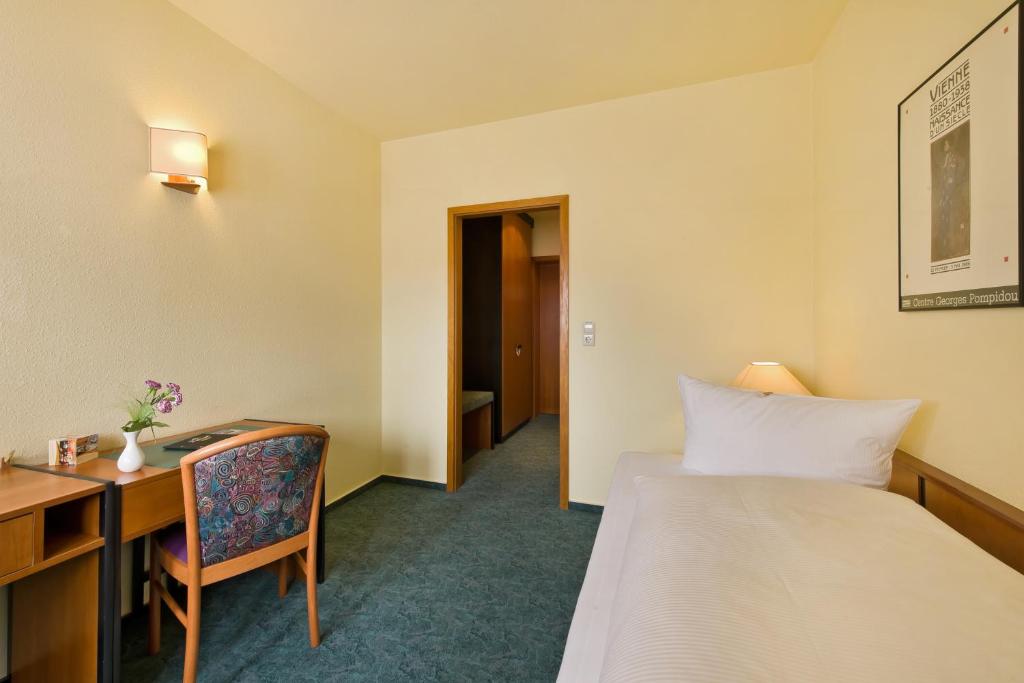 Postel nebo postele na pokoji v ubytování Hotel Katharinenhof
