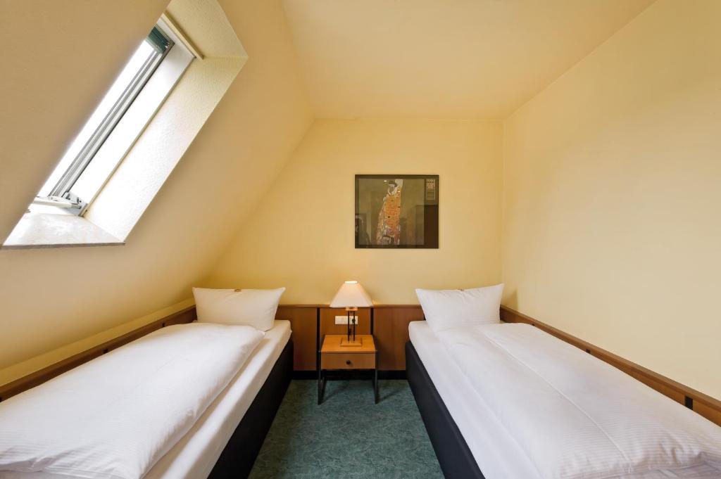 Postel nebo postele na pokoji v ubytování Hotel Katharinenhof