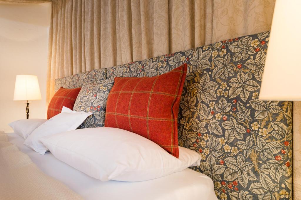 Postel nebo postele na pokoji v ubytování Schloss Prielau Hotel & Restaurants