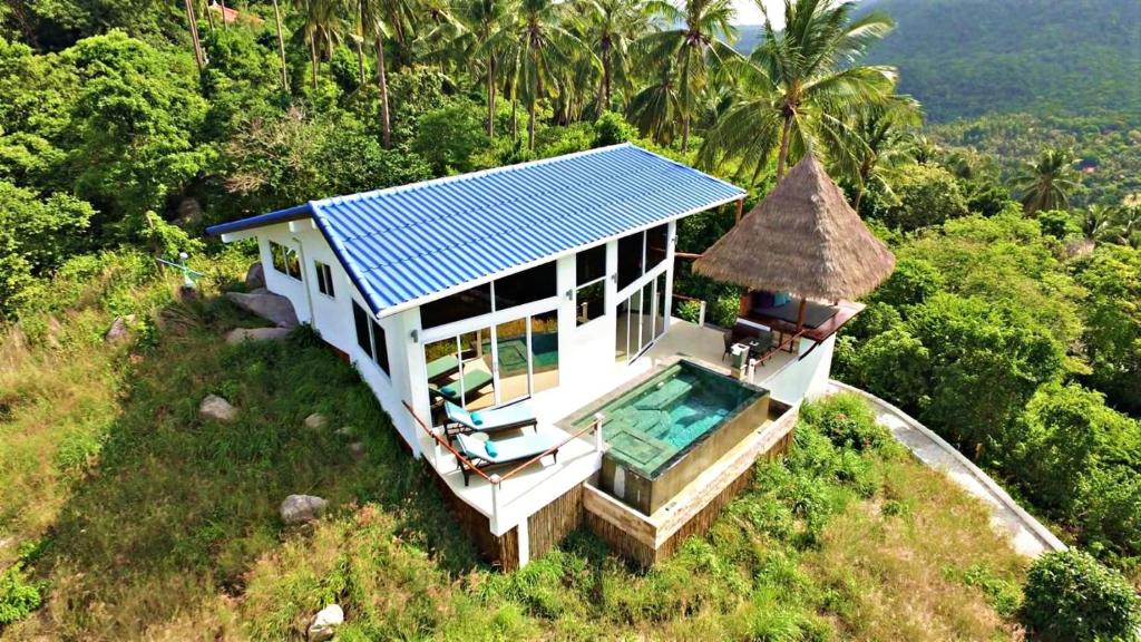 an aerial view of a house with a swimming pool at Horizon Luxury Pool Villas Koh Tao in Koh Tao