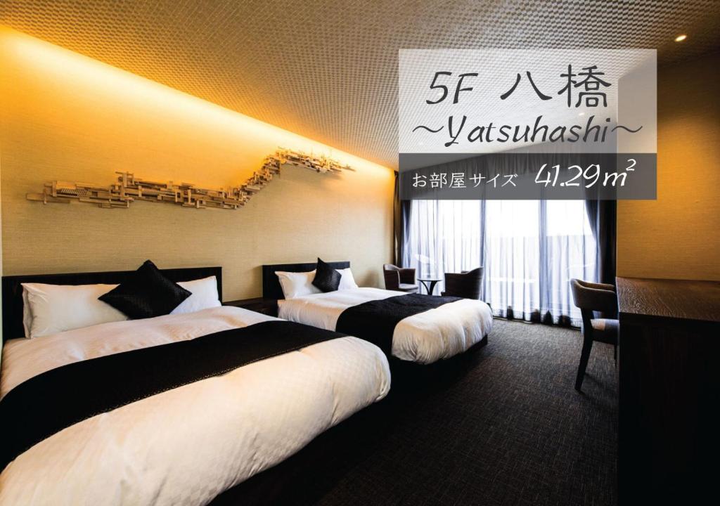 Postel nebo postele na pokoji v ubytování Hotel ZIZI Kyoto Gion