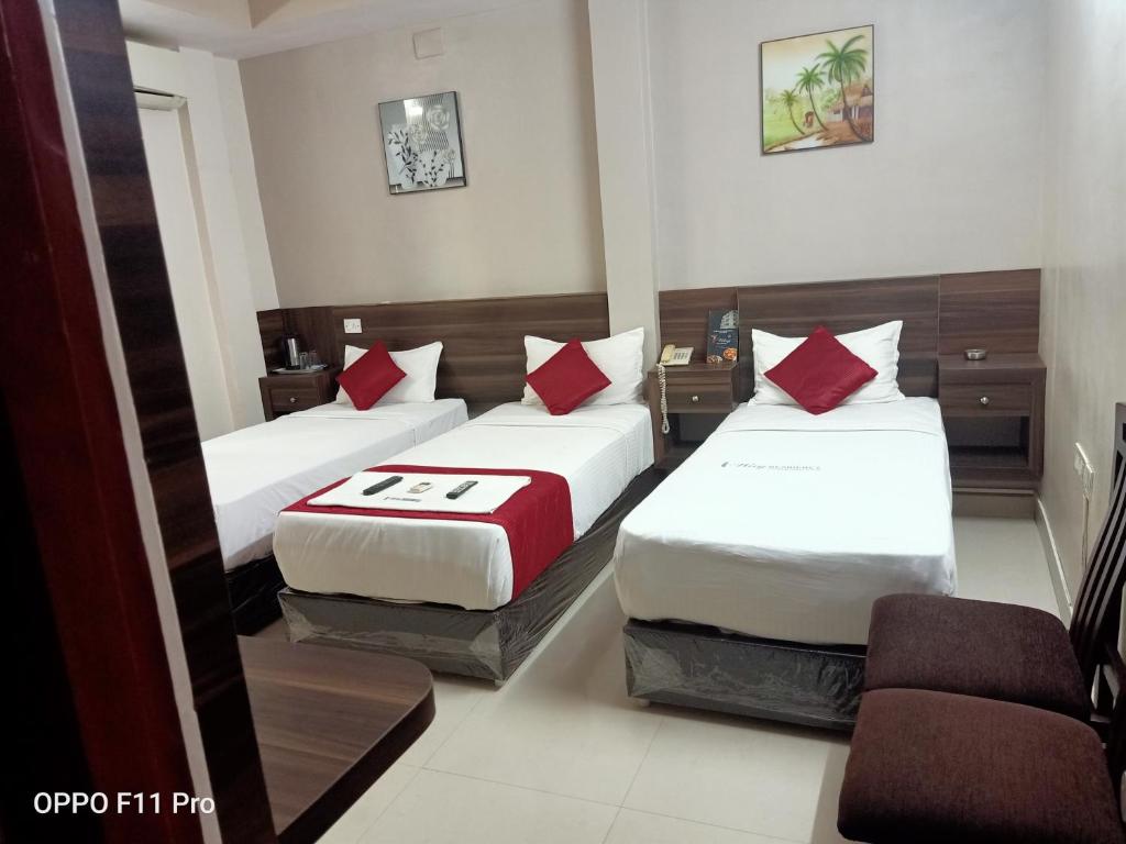 Postel nebo postele na pokoji v ubytování Hotel I-Way Residency Perungudi