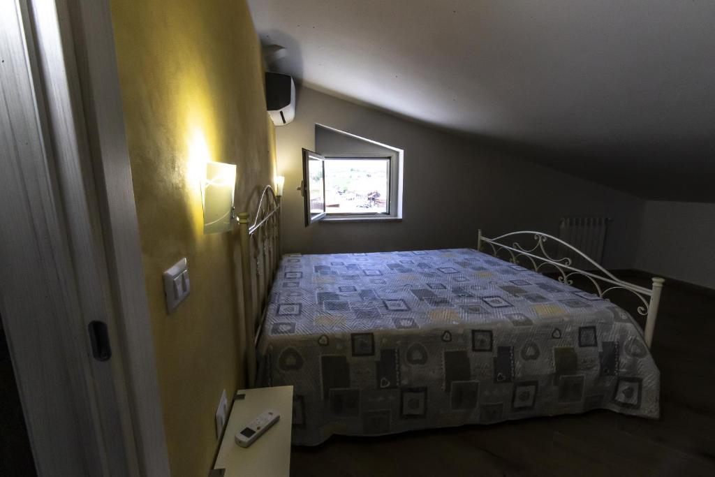 Posteľ alebo postele v izbe v ubytovaní La Mansarda Di BellaVista