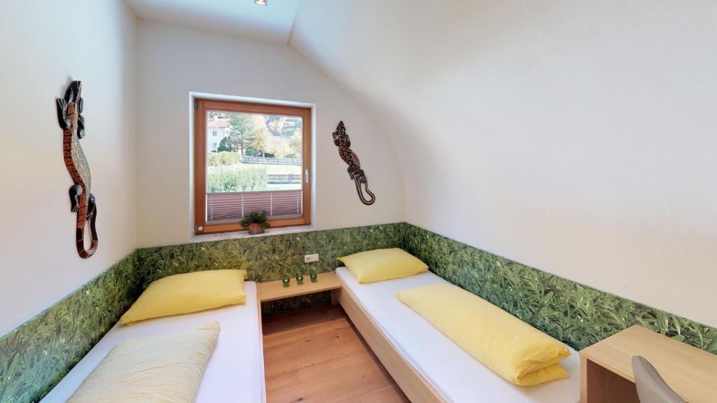 Postel nebo postele na pokoji v ubytování Villa Tschallener