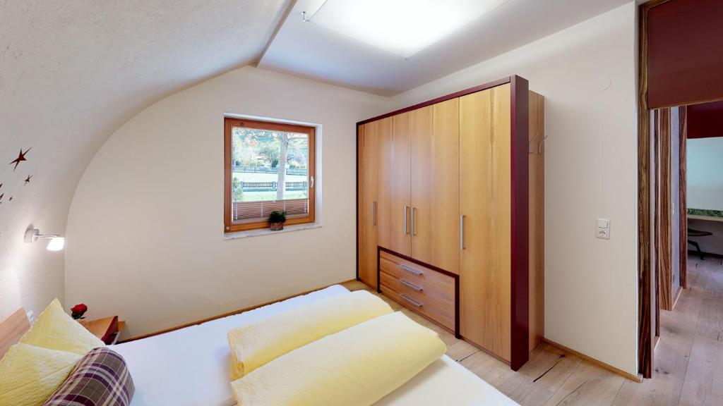 Postel nebo postele na pokoji v ubytování Villa Tschallener