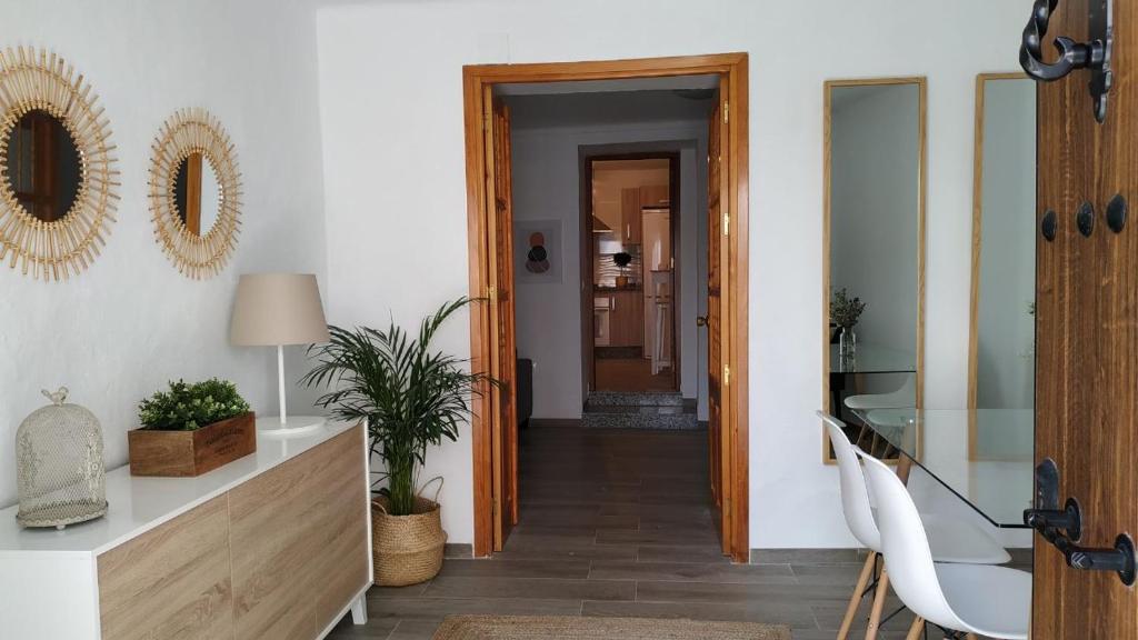 a hallway with a door leading to a living room at CASA EL REMANSO DE ZUHEROS in Zuheros