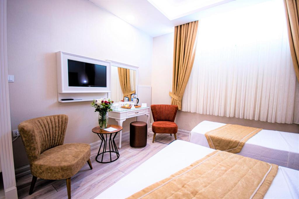 Postel nebo postele na pokoji v ubytování Boss Hotel Sultanahmet