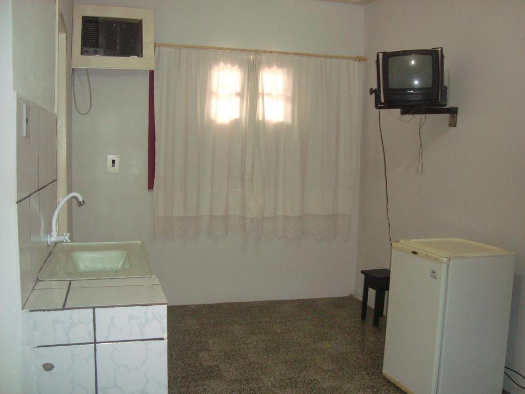 TV a/nebo společenská místnost v ubytování Residencial Ravasco