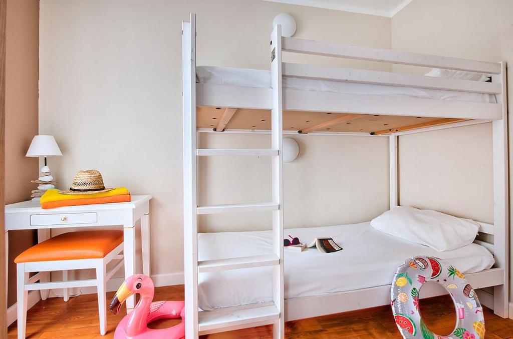 Postel nebo postele na pokoji v ubytování Hôtel Club la Font des Horts