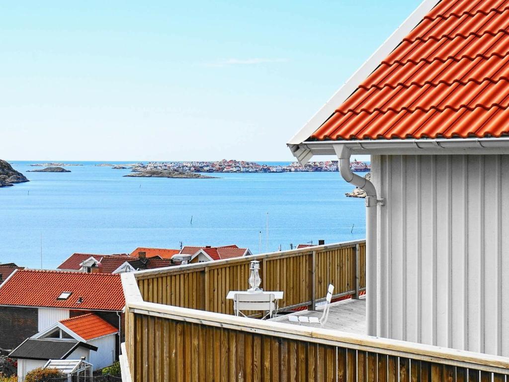 a balcony of a house with a view of the water at 2 person holiday home in R nn ng in Rönnäng