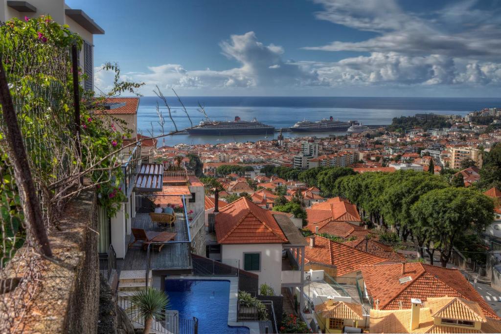 a view of a city with ships in the ocean at Number 15 Ocean & City View Villas in Funchal