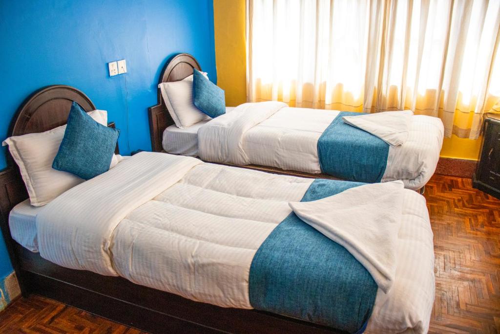 Postel nebo postele na pokoji v ubytování Hotel Green Horizon