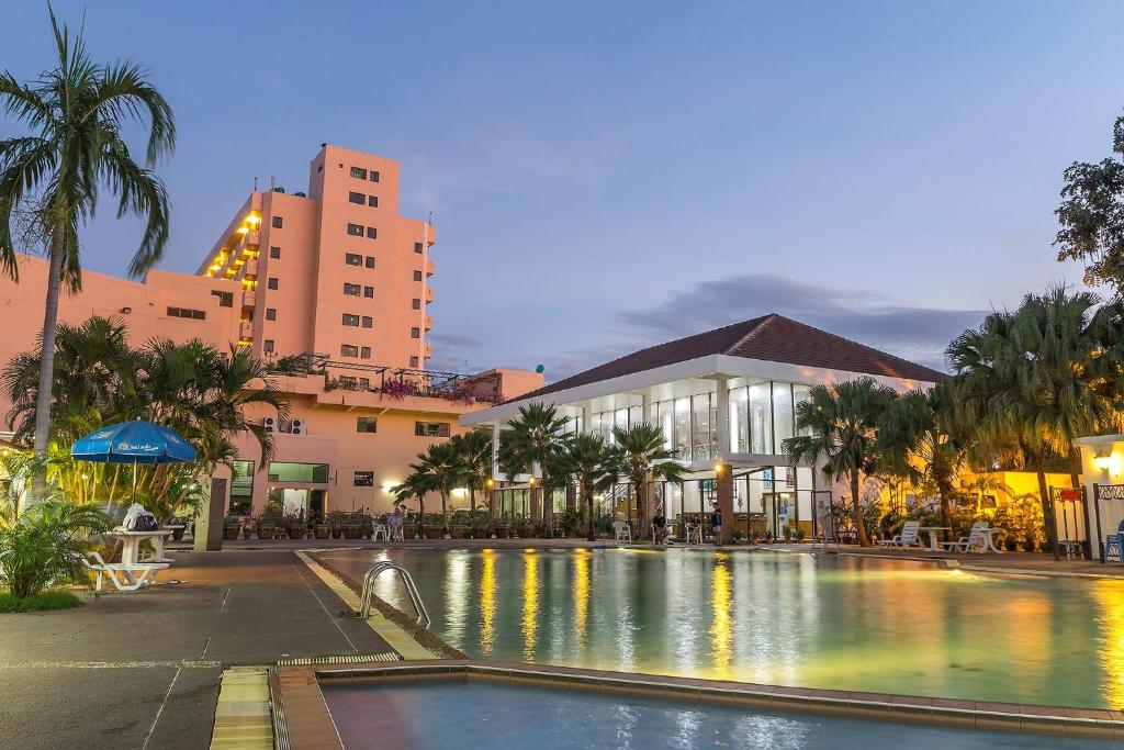 a large swimming pool in front of a building at Ban Chiang Hotel in Udon Thani