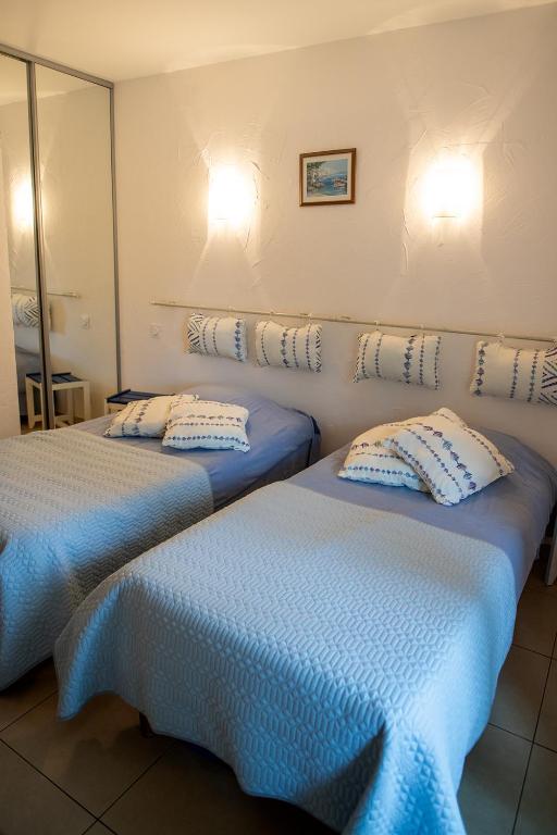 Postel nebo postele na pokoji v ubytování La Bastide des Pins