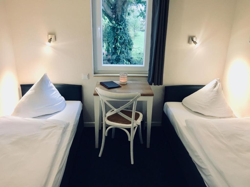 Una cama o camas en una habitación de Arcade Hotel & Hostel Hamburg