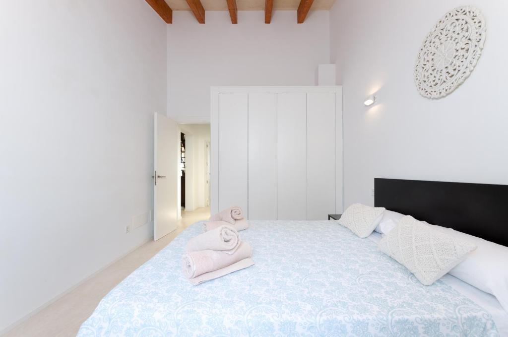 Postel nebo postele na pokoji v ubytování El Paraiso (Porto Cristo)