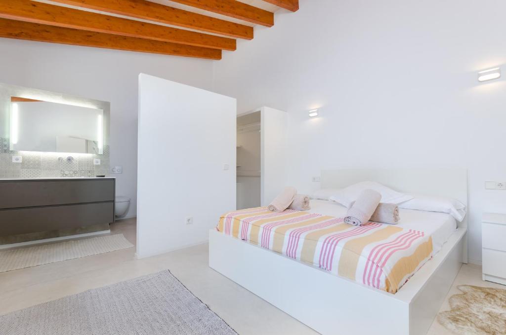 Postel nebo postele na pokoji v ubytování El Paraiso (Porto Cristo)
