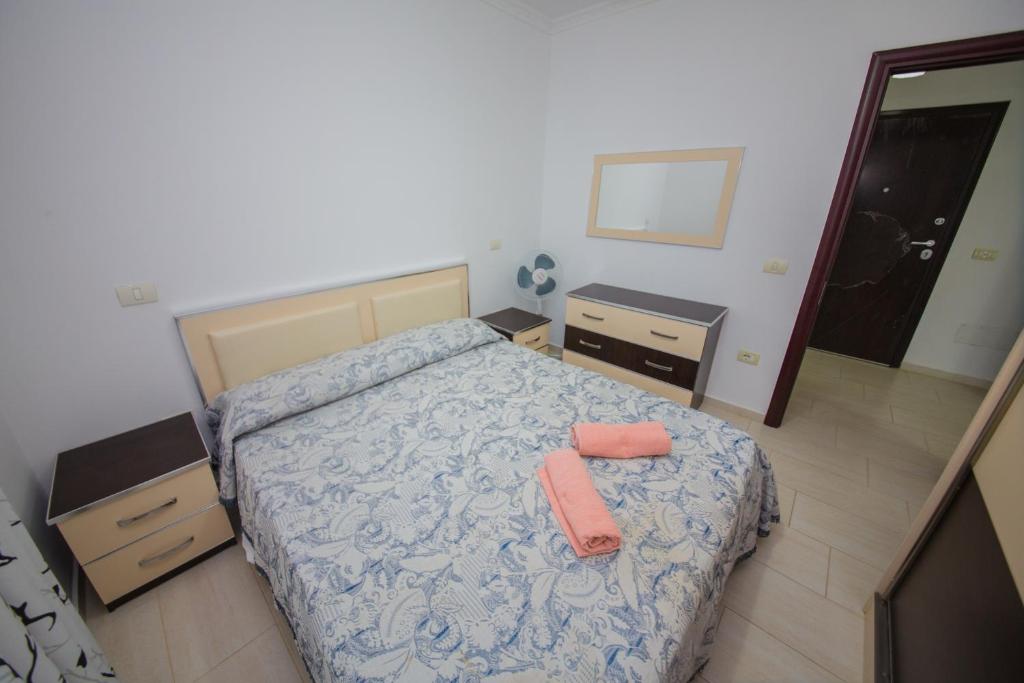 Postel nebo postele na pokoji v ubytování Apartments Qerret